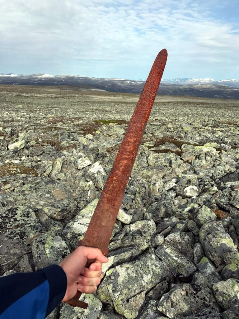 The finder holding the Viking sword without gloves