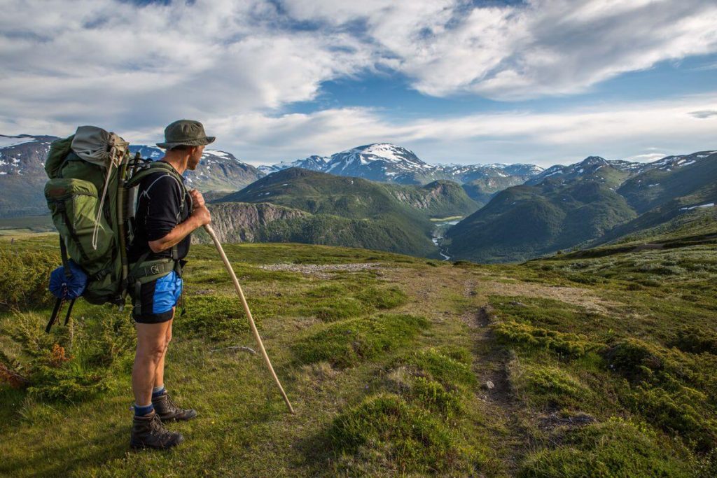 Reidar standing by the tracks of an old mountain route.