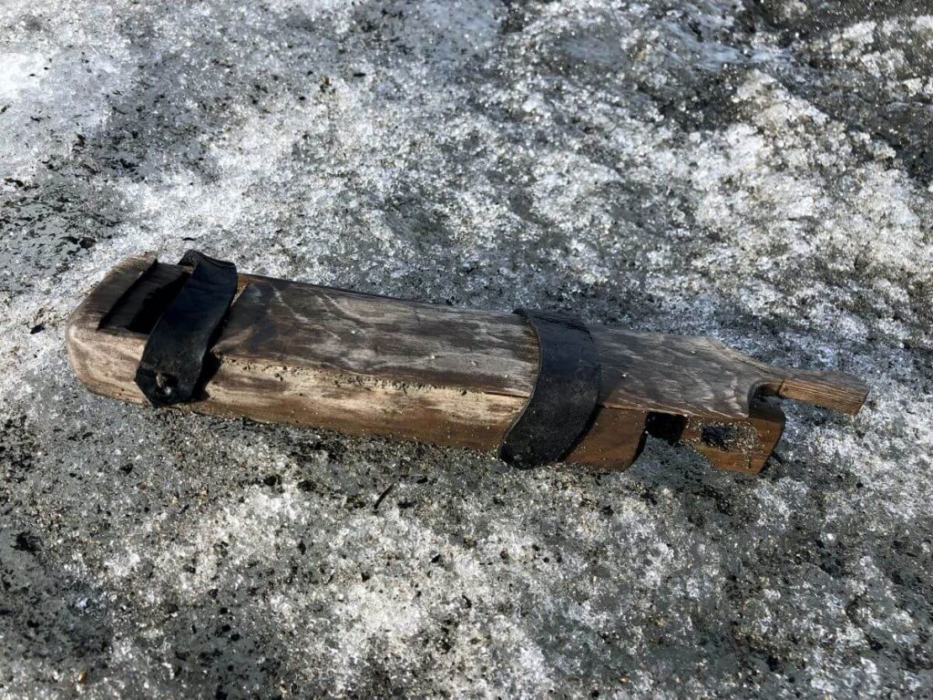 A wooden box, found on the surface of the ice in the mountain pass.