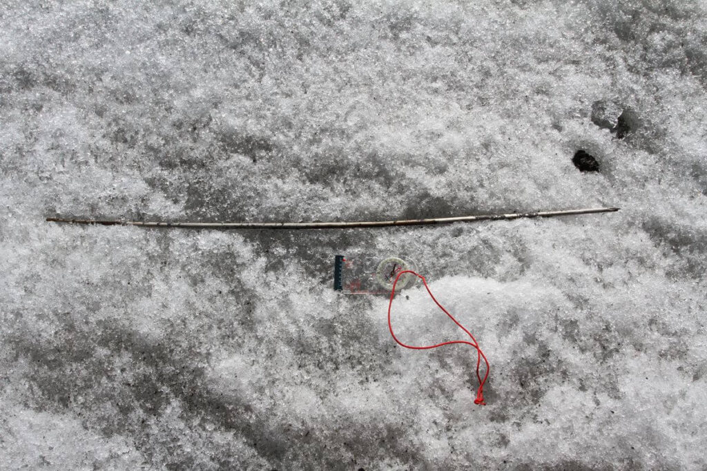 Neolithic arrow laying on the ice at Langfonne
