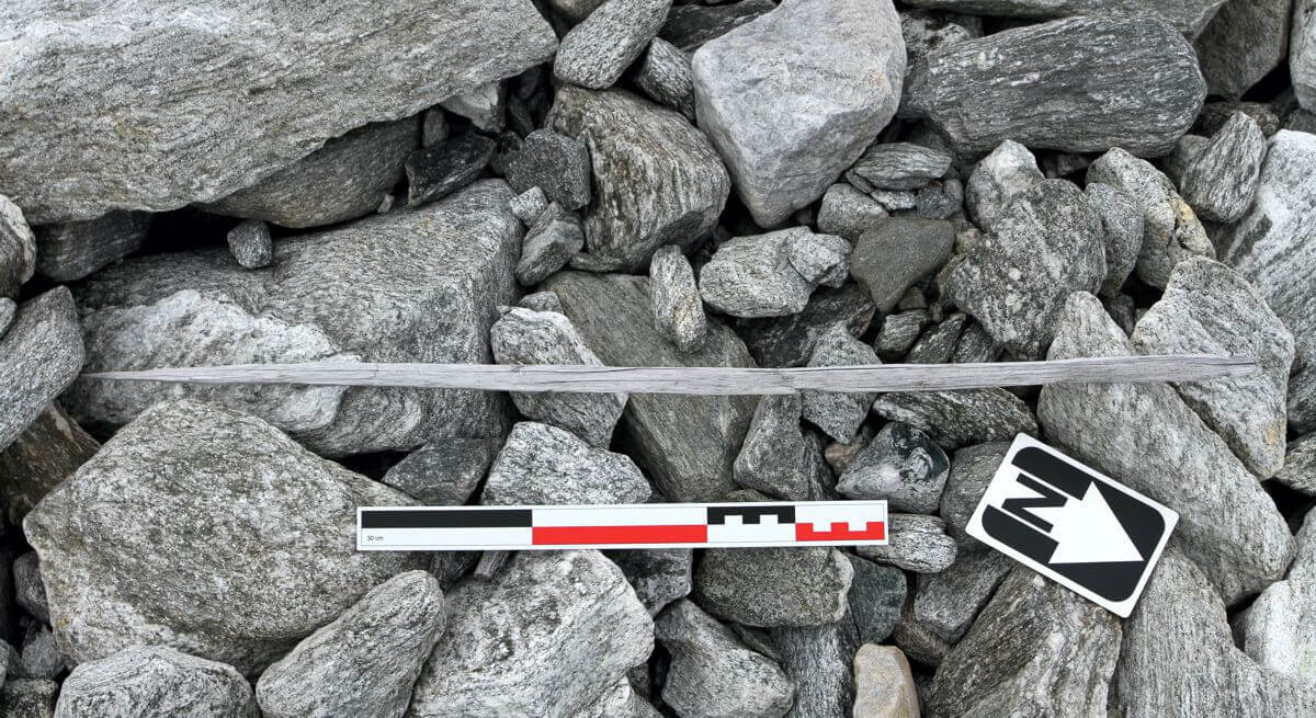 A scaring stick lying on the ground, found during the 2015 fieldwork